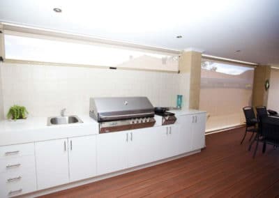 White Ziptrak blinds in outdoor dining area