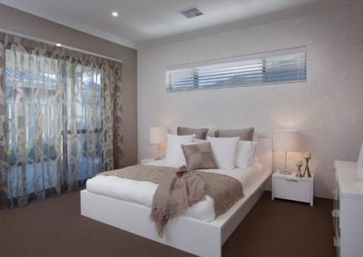 bedroom with sheer patterned curtains