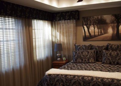 bedroom with taupe sheer curtains