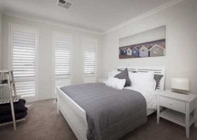 bedroom with white shutters
