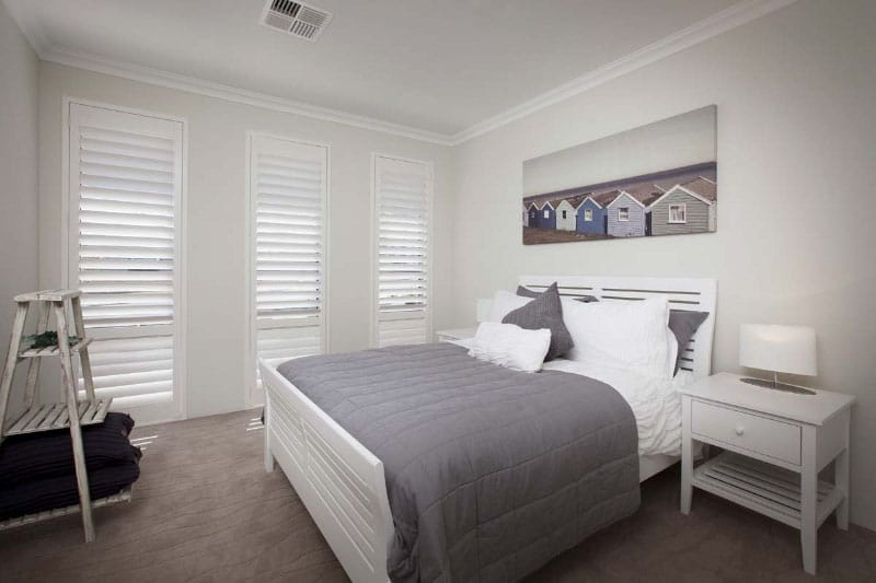 bedroom with white shutters