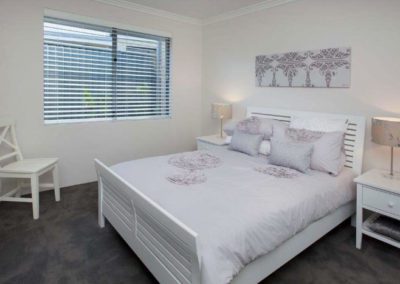 bedroom with white venetians