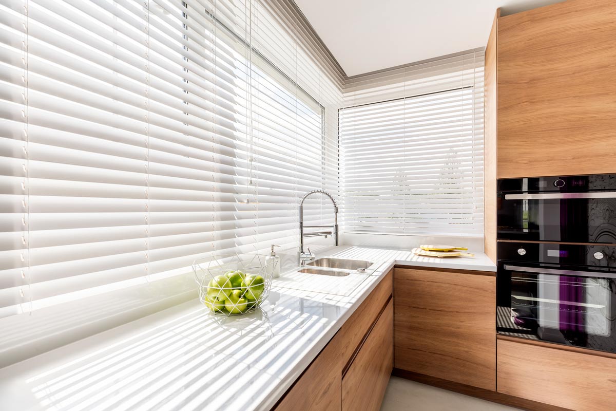 kitchen with white venetian blinds