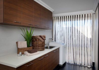 laundry room with striped curtains