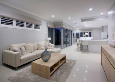 living room with padded pelmets and shutter blinds