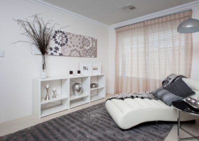living room with venetian blinds and sheer curtains