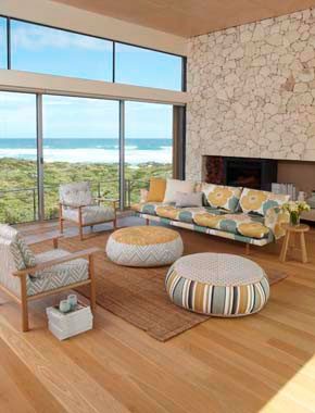 open home with patterned fabric couches and chairs