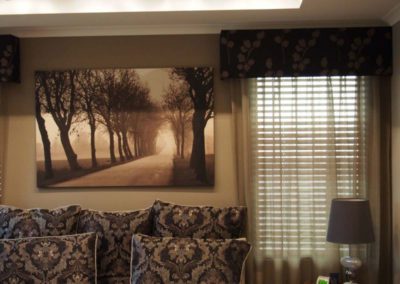 room with brown pelmets and taupe curtains