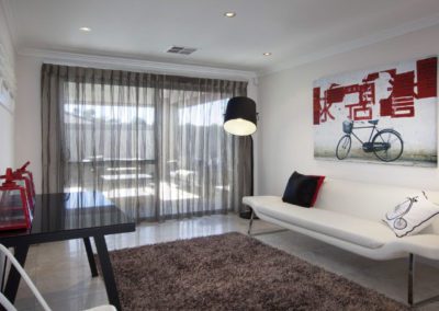 room with grey sheer curtains