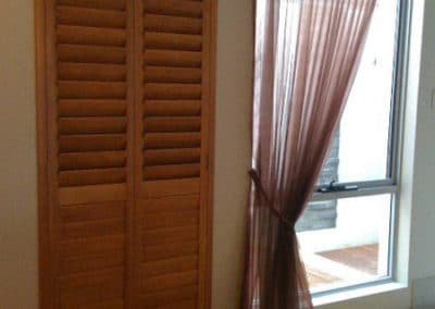 tall natural wood shutters