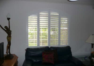 white arch window shutters