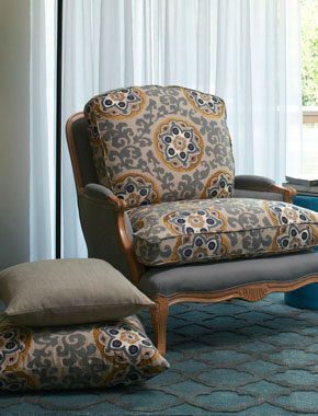 white curtains with patterened chair