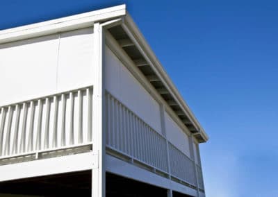 white outdoor blinds on balcony