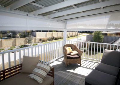 white outdoor blinds on deck