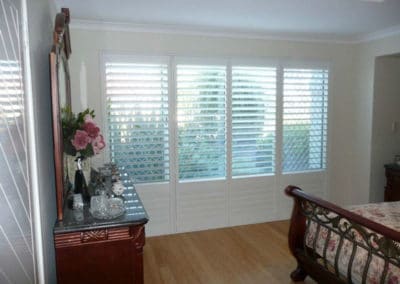 white shutters in bedroom