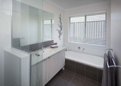 white venetian blinds in bathroom